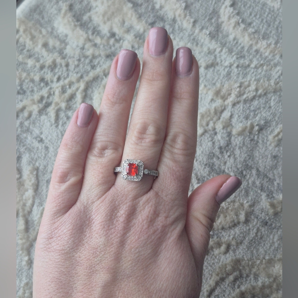 Radiant Silver Ring with Red Gemstone
